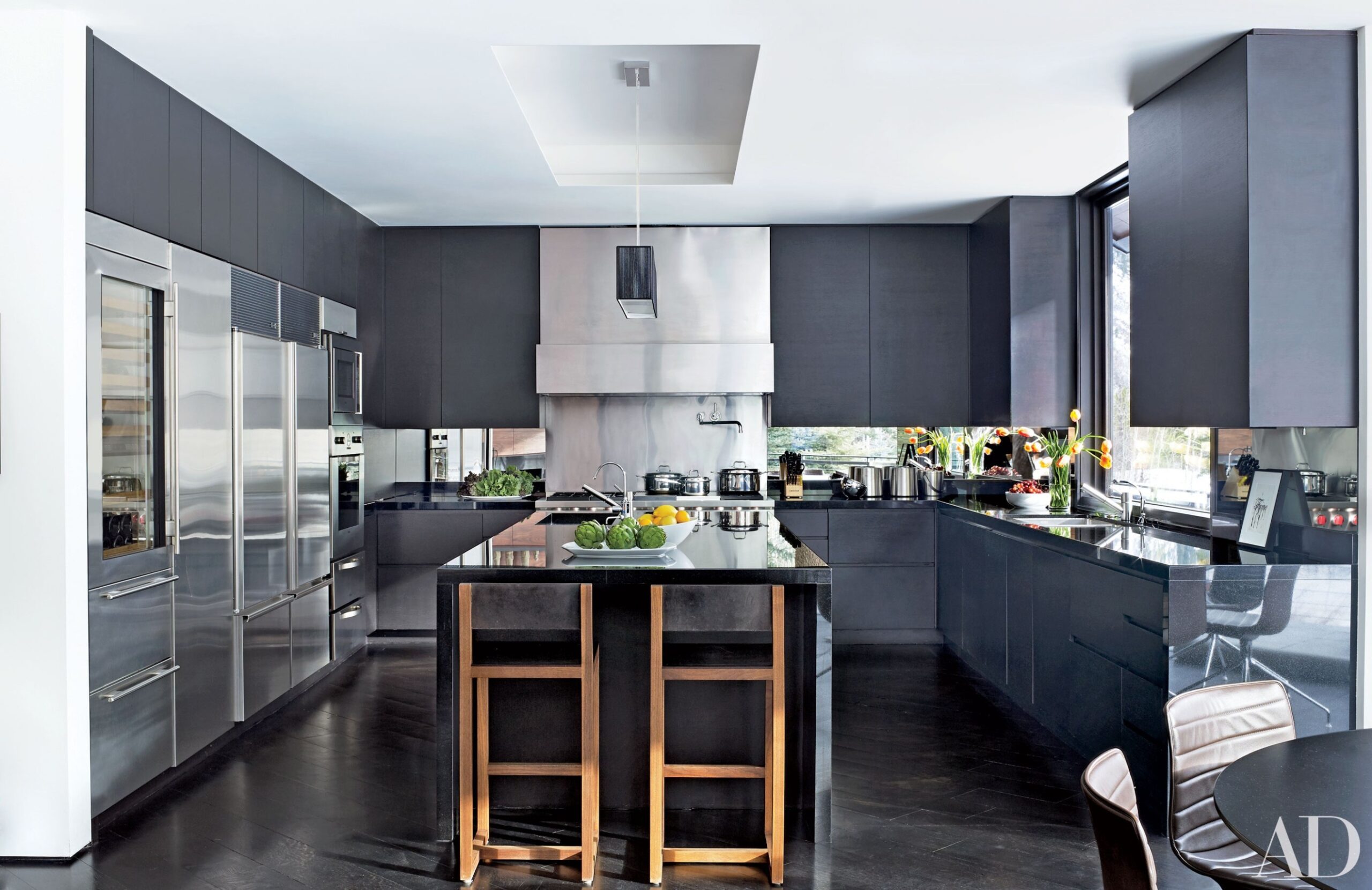 5 Black Countertops to Inspire Your Kitchen Renovation  - grey kitchen cabinets with black countertops