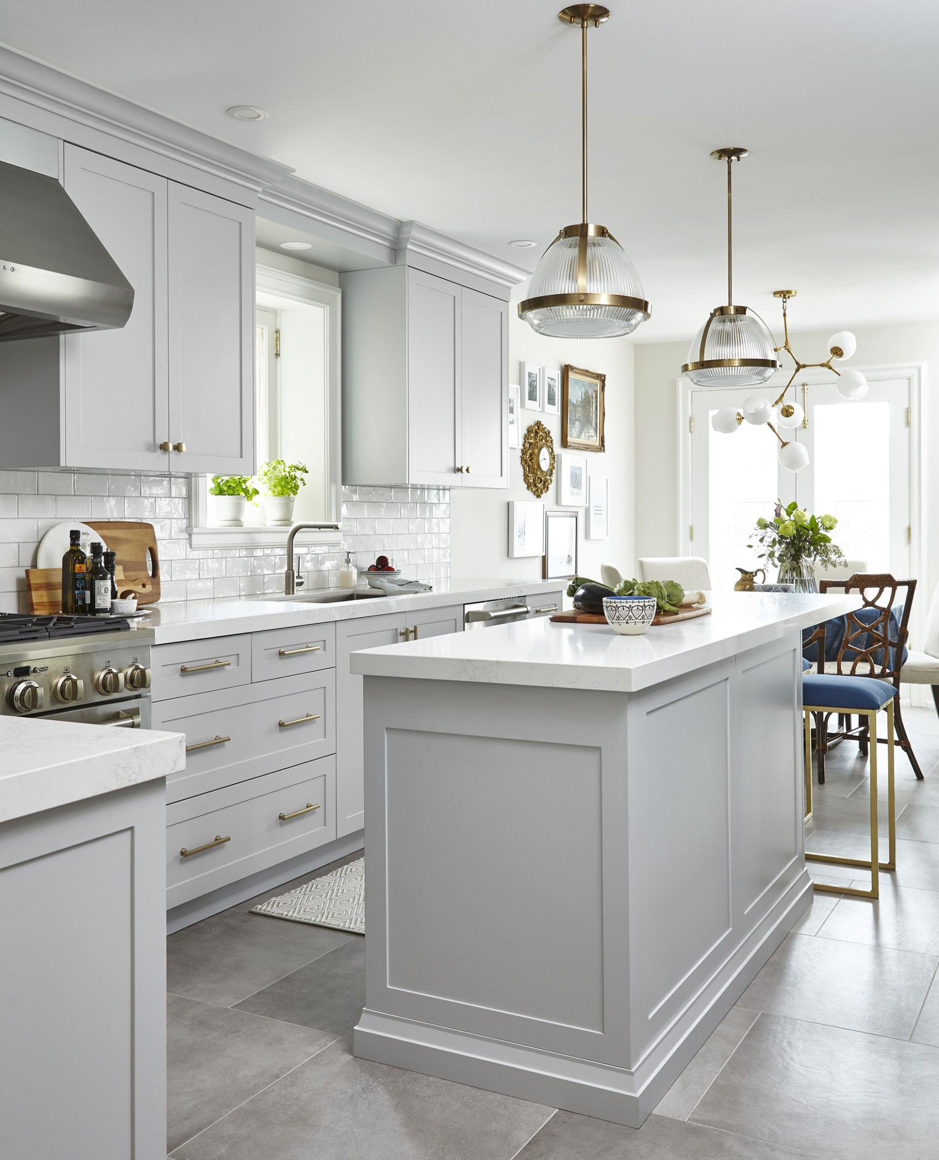 Light Grey Kitchen with celestial chandelier over the kitchen  - grey kitchens with white cabinets